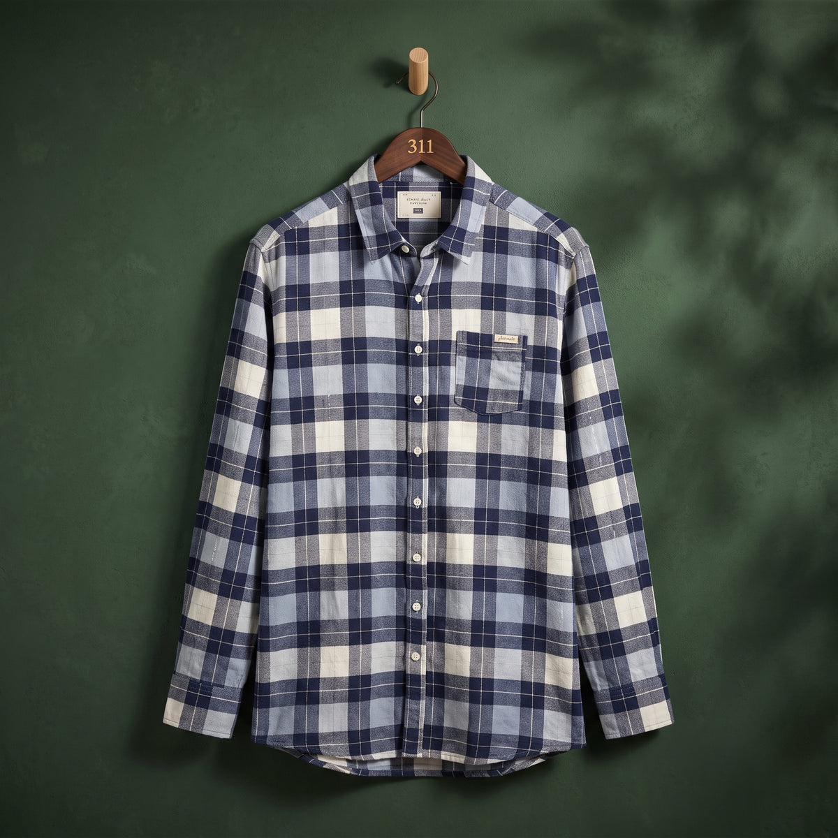 Women's navy, blue and white plaid check longline shirt with chest pocket – front view on hanger