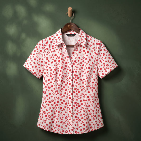 White shirt with red daisy print on hanger