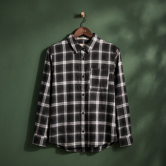 Women's black and white plaid check button-up shirt with long sleeves and chest pocket – front view